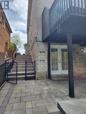 Mississauga (Streetsville) apartment for rent - A building with a white door and a black gate.