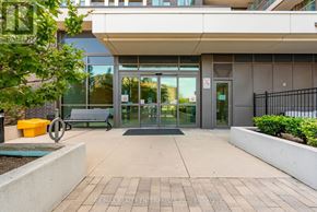 Toronto (West Humber-Clairville) condo for rent - The image shows the entrance to a building with glass doors and a bench outside.