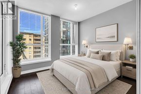 Toronto (West Humber-Clairville) condo for rent - A bedroom with a large bed, a potted plant, and a window with blinds.