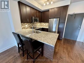 Mississauga (Erin Mills) condo for rent - A kitchen with a granite countertop and stainless steel appliances.