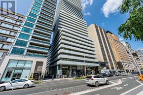 Toronto (Annex) condo for rent - A street view of a city with cars and buildings.