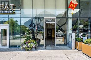 Toronto (Annex) condo for rent - A gym and a McDonald's restaurant are visible through a large window.