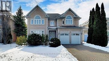 Markham (Cachet) apartment for rent - A large house with a driveway in front of it.