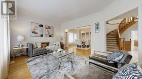 Markham (Cachet) apartment for rent - A living room with a marble coffee table and a staircase in the background.