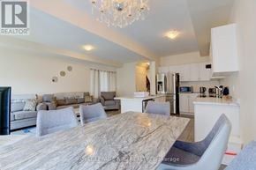 Niagara Falls (Morrison) townhouse for rent - A modern dining room with a marble table and grey chairs.
