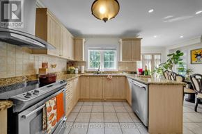 Newmarket (Woodland Hill) apartment for rent - A kitchen with a stove top oven and a dishwasher.