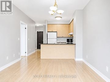 Vaughan (Beverley Glen) condo for rent - A well-lit kitchen area with wooden floors and a central island.