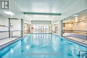 Vaughan (Beverley Glen) condo for rent - A large indoor swimming pool with a glass divider.