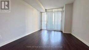 Toronto (Willowdale East) condo for rent - A room with wooden floors and white walls, with a window covered by vertical blinds.