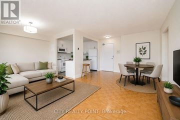 Toronto (University) condo for rent - A living room with a white couch and a coffee table.