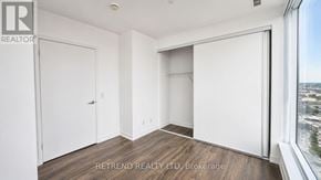Vaughan (Vaughan Corporate Centre) condo for rent - A room with a large window and a view of the city.
