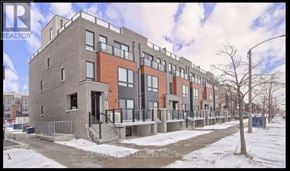 Toronto (Malvern) townhouse for rent - A building with a red brick facade is shown in the image.