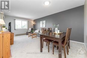 Ottawa condo for rent - A dining room with a wooden table and chairs.