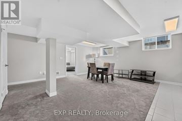 Niagara Falls (Lyons Creek) apartment for rent - A living room with a dining table and chairs.