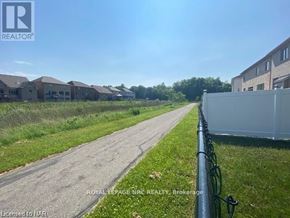 Niagara Falls (Brown) apartment for rent - A road in a residential area with houses on both sides.