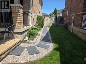 Milton (De Dempsey) apartment for rent - A residential area with a well-maintained garden and a stone pathway.