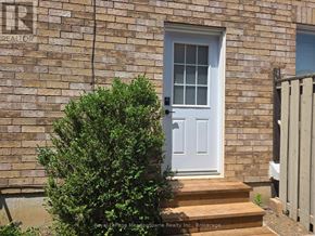 Milton (De Dempsey) apartment for rent - A white door is on the front of a brick house.