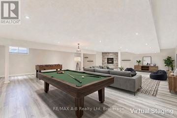 West Perth (Mitchell) apartment for rent - A virtual staging of a living room with a pool table and a couch.