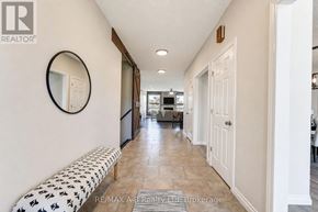 West Perth (Mitchell) apartment for rent - A hallway with a bench and a mirror on the wall.