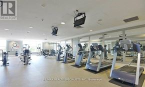 Mississauga (City Centre) condo for rent - A gym with treadmills, weights, and exercise equipment.