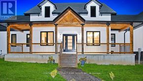 West Grey apartment for rent - A house with a porch and a front yard.