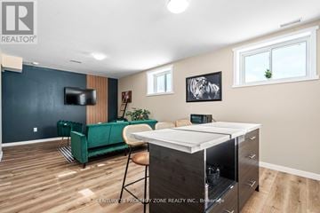 West Grey apartment for rent - A living room with a green sofa and a television.