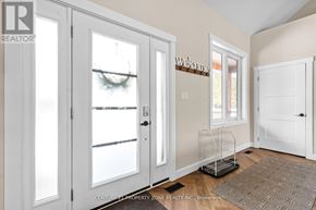 West Grey apartment for rent - A room with a welcome sign on the door and a window showing a snowy scene outside.