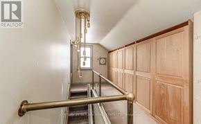 Brampton (Downtown Brampton) apartment for rent - A staircase with a metal railing and wooden steps.