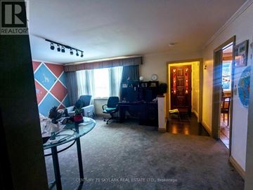 Brampton (Downtown Brampton) apartment for rent - A living room with a glass table and a blue couch.