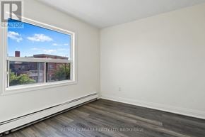 St. Catharines (E. Chester) apartment for rent - A room with a window showing a view of a building outside.