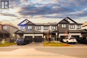 Clarence-Rockland townhouse for rent - A modern house with a blue window is for sale by Royal LePage Integrity Realty Brokerage.