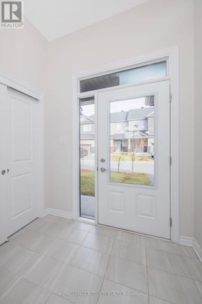 Clarence-Rockland townhouse for rent - A white door with a glass window is in a room with white walls.