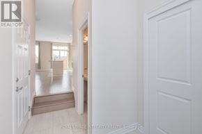 Clarence-Rockland townhouse for rent - A white door is open to a hallway with a tiled floor.
