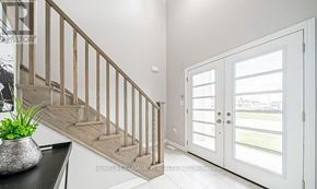 Welland (Lincoln/Crowland) apartment for rent - A white interior with a staircase and a door leading to a balcony.