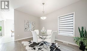 Welland (Lincoln/Crowland) apartment for rent - A dining room with a glass table and white chairs.