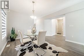 Welland (Lincoln/Crowland) apartment for rent - A modern dining room with a glass table and white chairs.