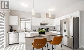Welland (Lincoln/Crowland) apartment for rent - A modern kitchen with a center island and two chairs.