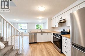 Waterloo apartment for rent - A kitchen with white cabinets and stainless steel appliances.