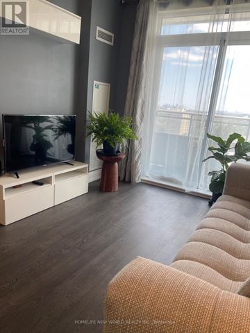 Vaughan (Beverley Glen) condo for rent - A living room with a television and a plant on a table.