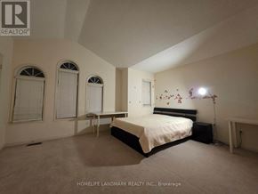 Richmond Hill (Westbrook) apartment for rent - A bedroom with a bed, two chairs, and a window.
