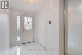 Toronto (L'amoreaux) townhouse for rent - A white door with a glass window is in a room with white walls.