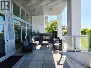Coquitlam apartment for rent - A balcony with a black chair and a fireplace.