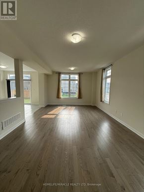 Loyalist (Bath) apartment for rent - A spacious room with wooden flooring and large windows.