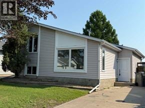 Lloydminster apartment for rent - A small house with a white door and windows is for sale.