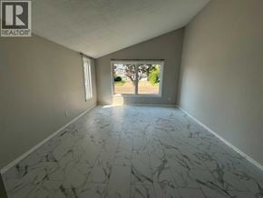 Lloydminster apartment for rent - A room with marble tiles flooring and a window.