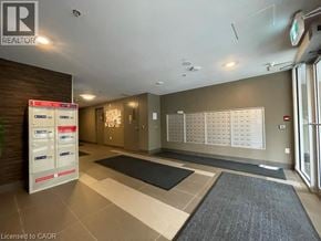 Waterloo condo for rent - A realtor's office with a white board on the wall.