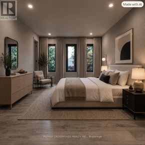 Toronto (Bridle Path-Sunnybrook-York Mills) apartment for rent - A well-lit bedroom with a large bed, a chair, and a side table.