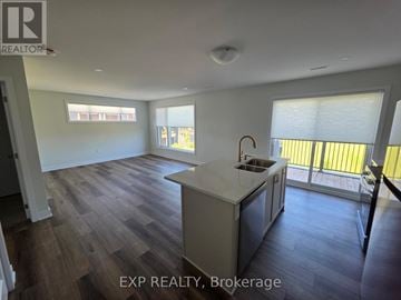 Ottawa townhouse for rent - A kitchen with a sink and a window.