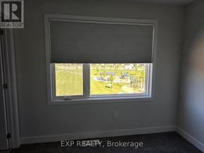 Ottawa townhouse for rent - A room with a window showing a view of a park.