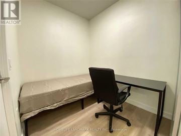 Toronto (Annex) condo for rent - A room with a bed and a desk.